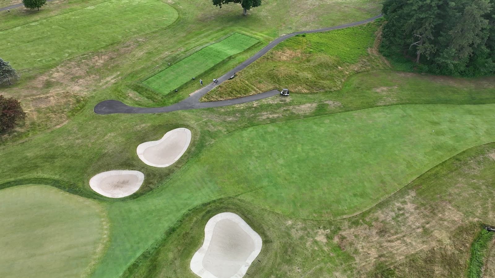 Overhead drone view of tee boxes, bunkers and fairway at a Connecticut golf club